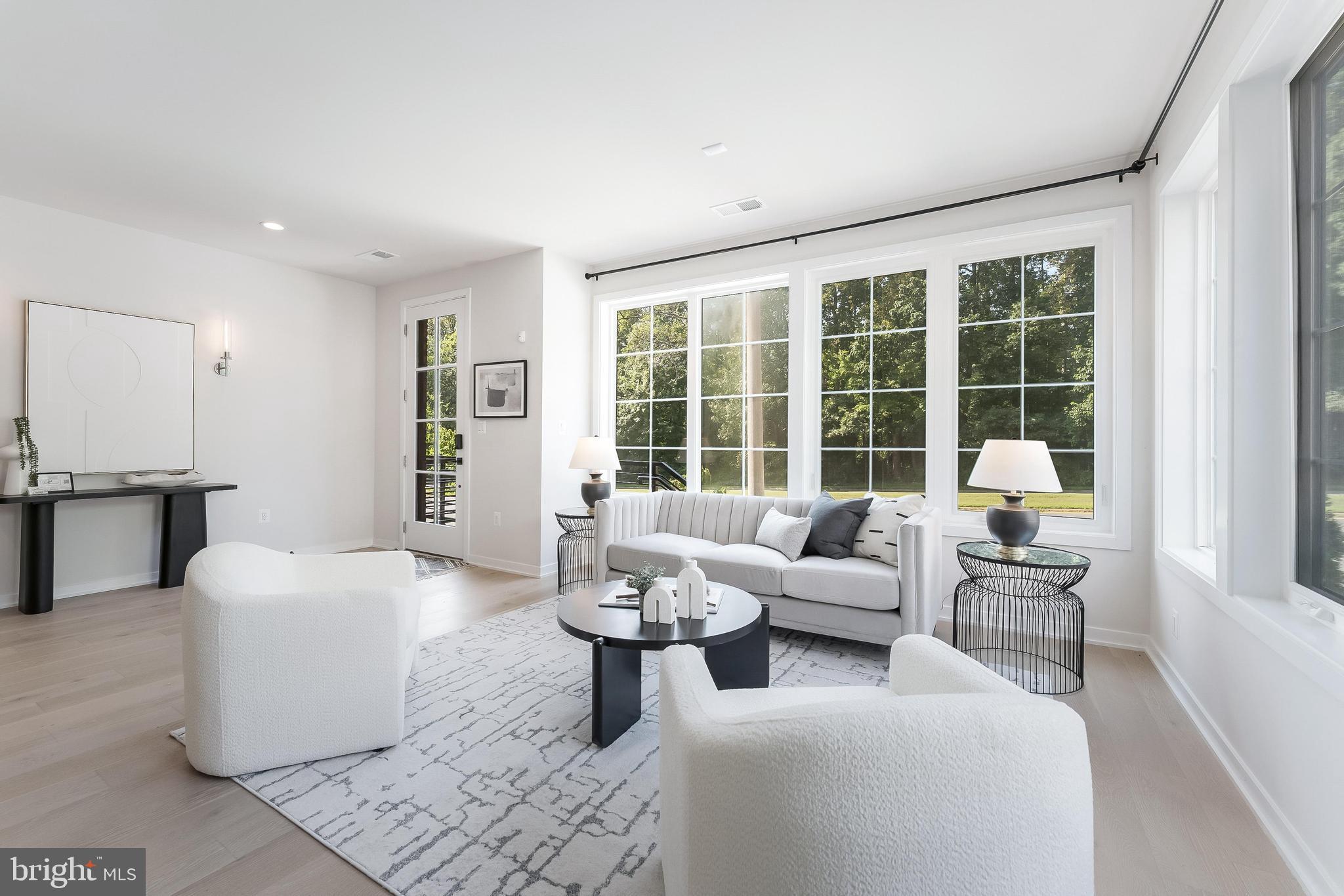 11748 Sunrise Valley Drive Reston, VA 20191 - Photo 8 of 60 a living room with furniture and floor to ceiling windows