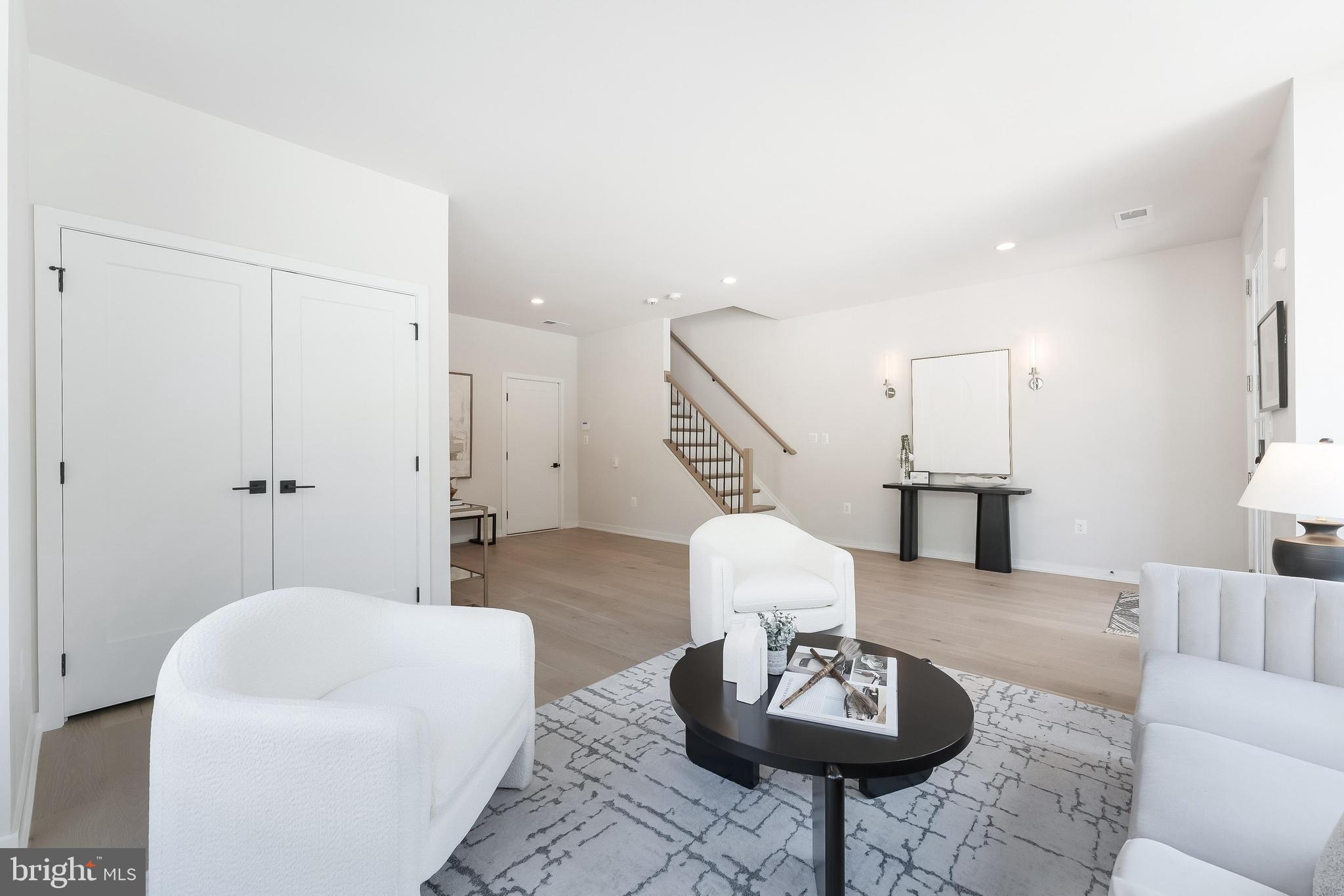 11748 Sunrise Valley Drive Reston, VA 20191 - Photo 9 of 60 a living room with furniture and wooden floor