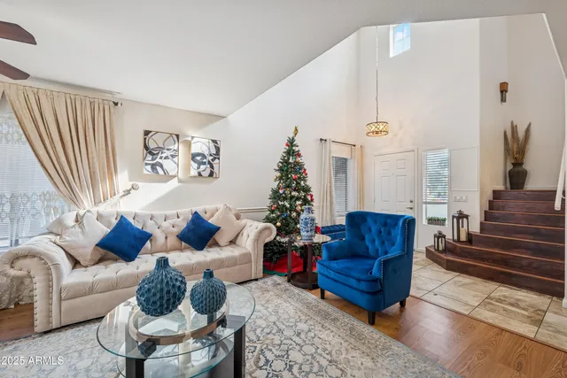 a living room with furniture or couch and a potted plant