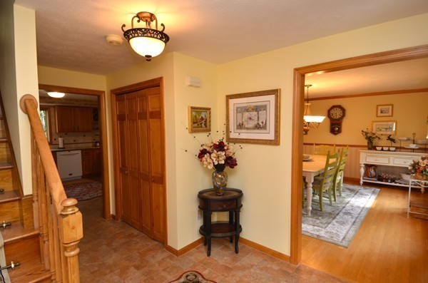 259 Green Road Bolton, MA 01740 - Photo 6 of 24 a view of a livingroom with furniture a chandelier and wooden floor
