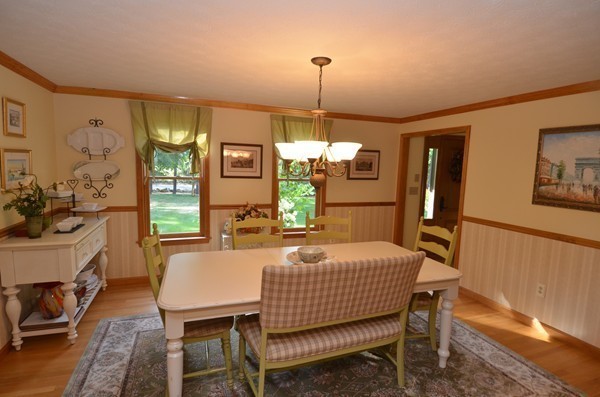 259 Green Road Bolton, MA 01740 - Photo 7 of 24 a dining room with furniture a chandelier and window