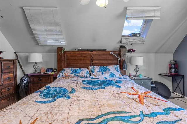 a bedroom with a bed and dresser