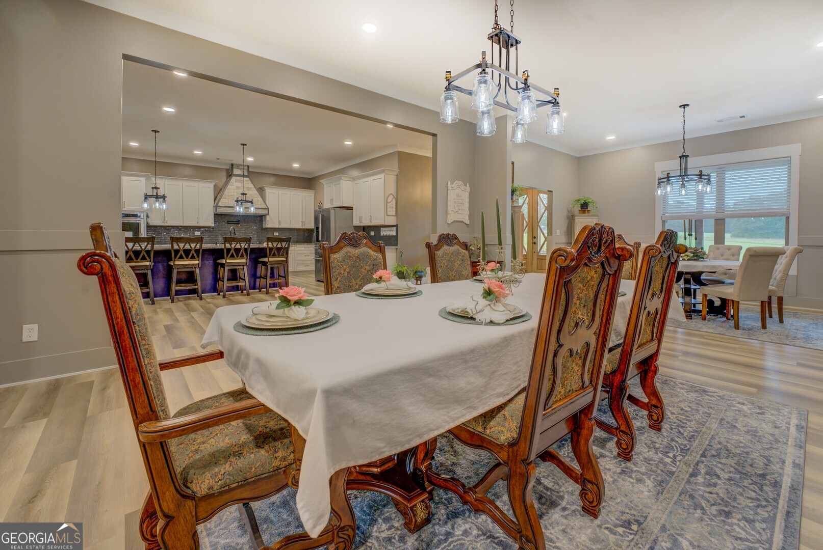 70 McDonald Road Covington, GA 30014 - Photo 12 of 84 a view of a dining room with furniture and wooden floor