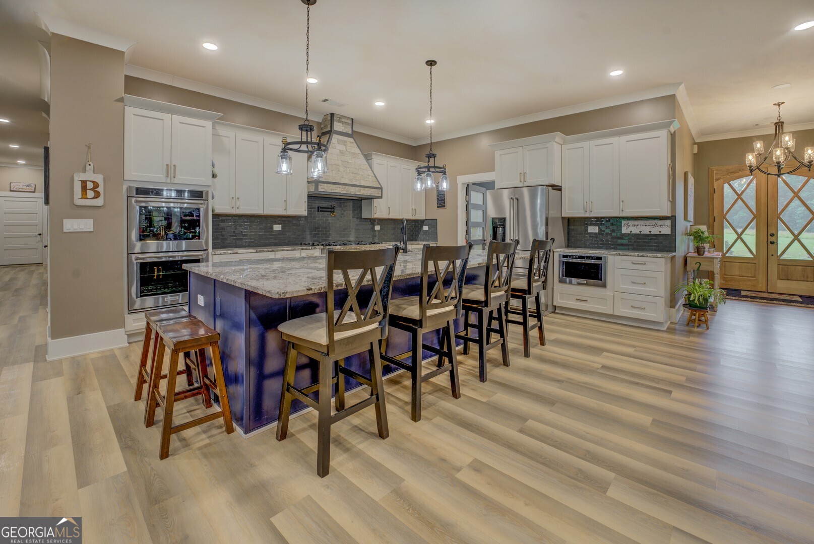 70 McDonald Road Covington, GA 30014 - Photo 14 of 84 a view of a dining area with furniture and wooden floor