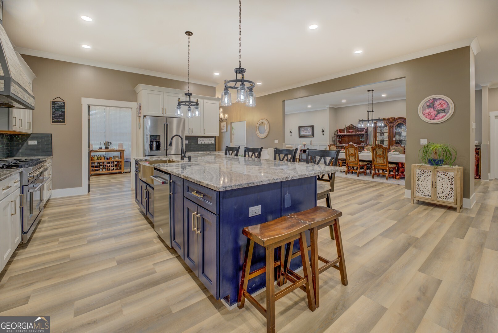 70 McDonald Road Covington, GA 30014 - Photo 15 of 84 a large kitchen with stainless steel appliances granite countertop a stove oven and a refrigerator