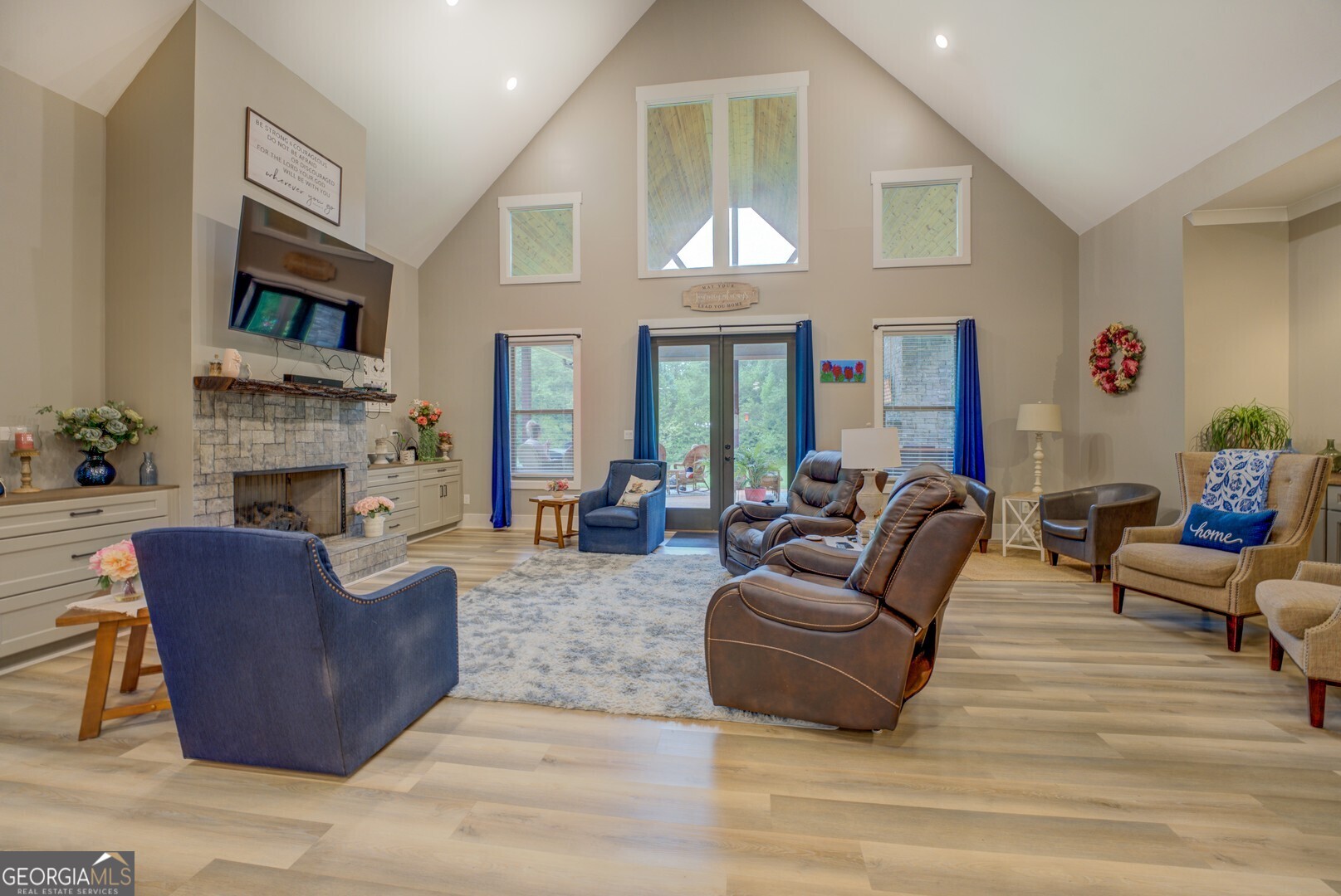 70 McDonald Road Covington, GA 30014 - Photo 24 of 84 a living room with furniture a fireplace and a large window