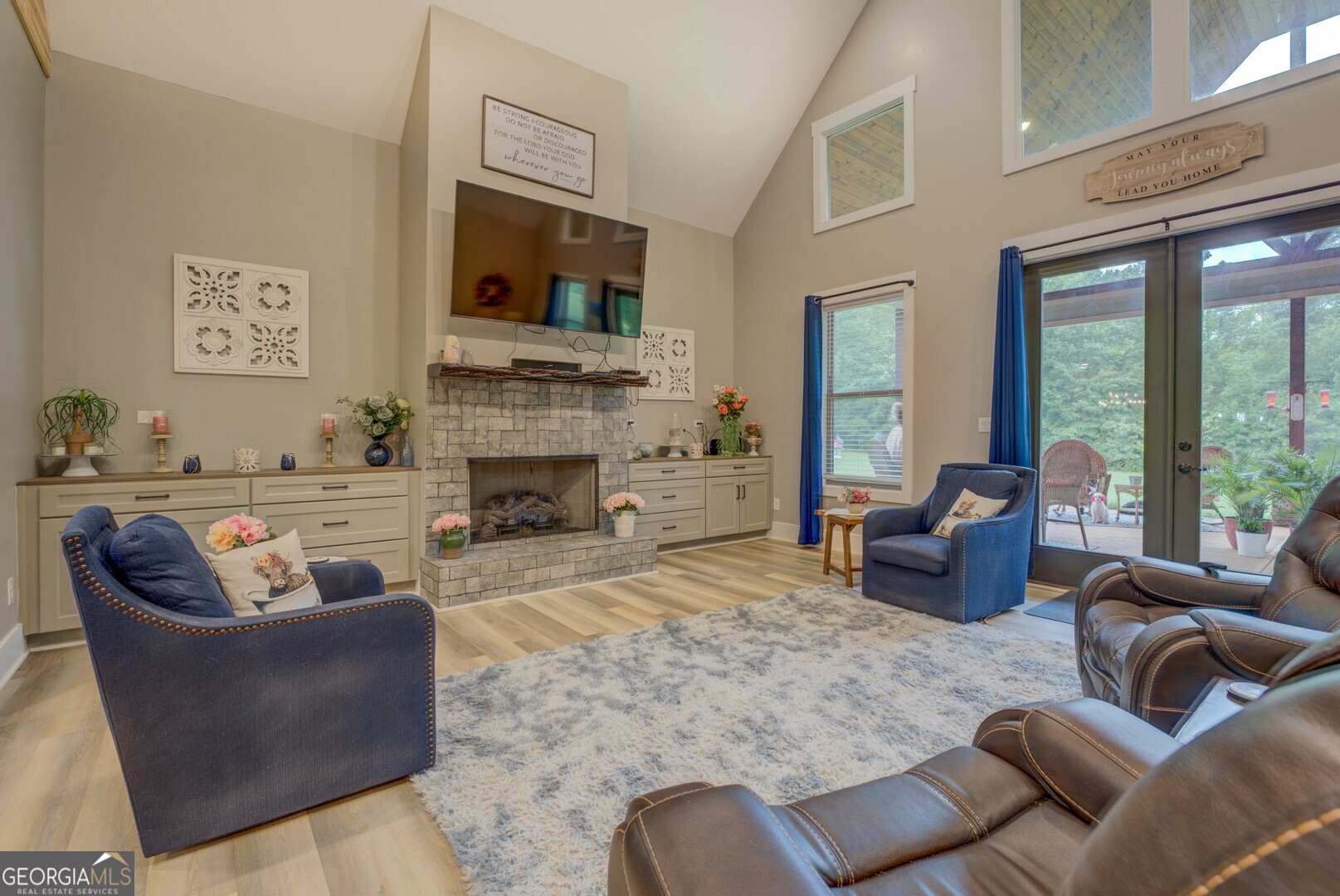 70 McDonald Road Covington, GA 30014 - Photo 25 of 84 a living room with furniture a large window and a fireplace