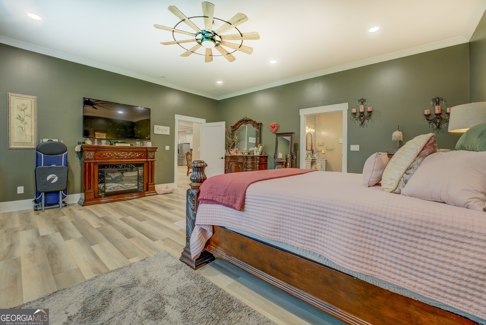 70 McDonald Road Covington, GA 30014 - Photo 32 of 84 a spacious bedroom with a bed and a flat screen tv