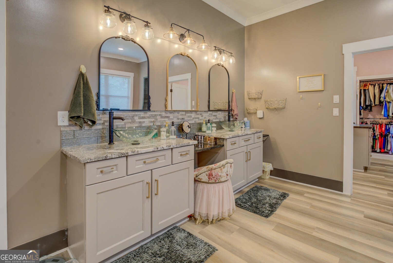 70 McDonald Road Covington, GA 30014 - Photo 34 of 84 a bathroom with a sink and a mirror