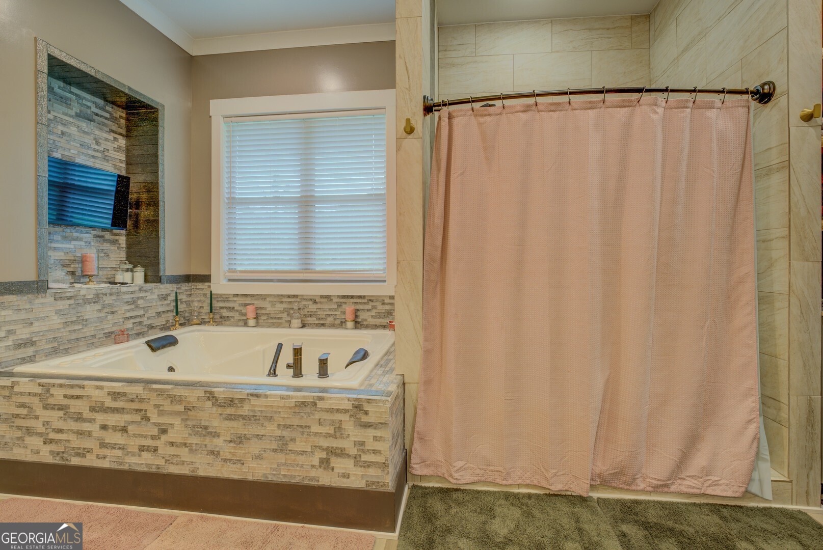 70 McDonald Road Covington, GA 30014 - Photo 35 of 84 a bathroom with a bathtub and a shower