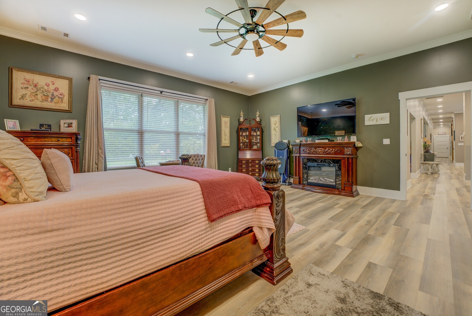 70 McDonald Road Covington, GA 30014 - Photo 41 of 84 a bedroom with a large bed a flat tv screen and a dresser