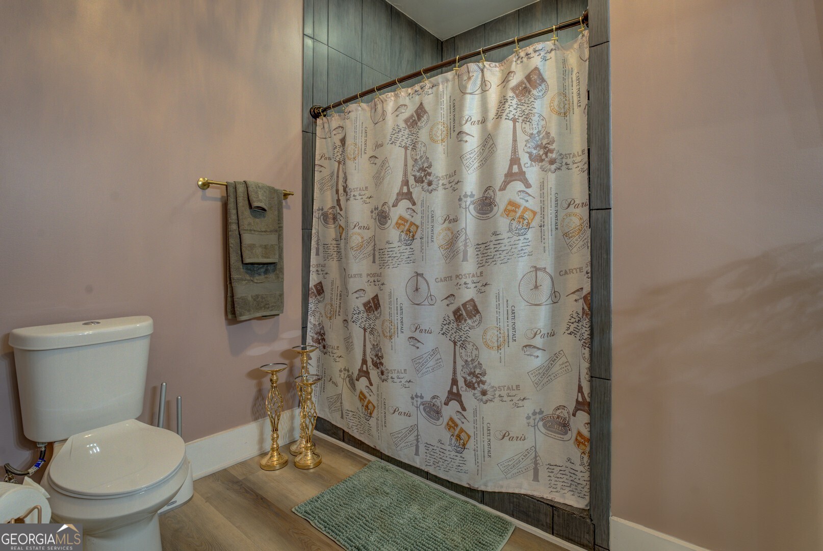 70 McDonald Road Covington, GA 30014 - Photo 56 of 84 a bathroom with a toilet and a shower curtain