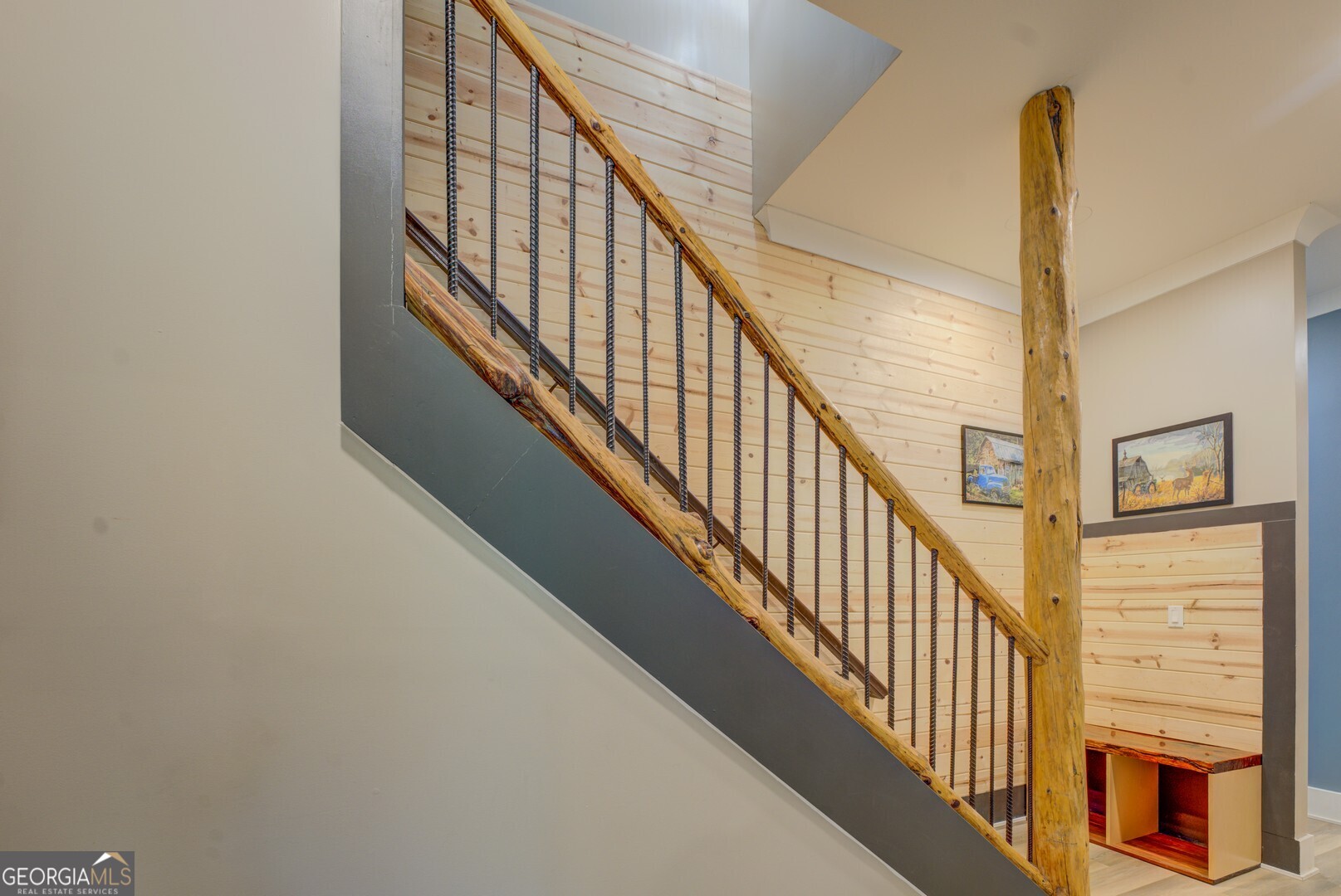 70 McDonald Road Covington, GA 30014 - Photo 59 of 84 a view of staircase with lots of frames on wall and a window