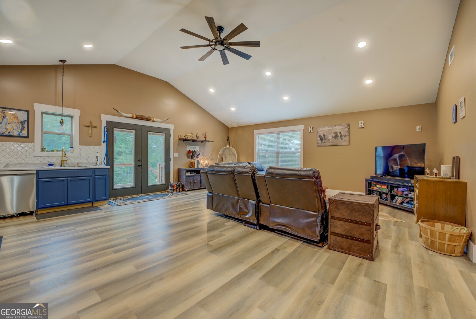 70 McDonald Road Covington, GA 30014 - Photo 60 of 84 a living room with furniture and kitchen view