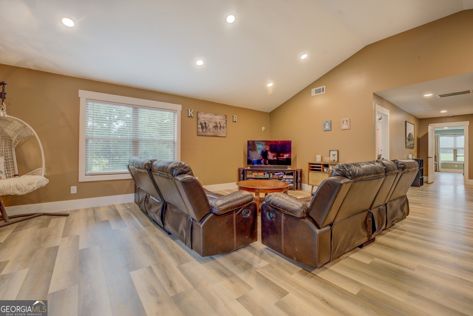 70 McDonald Road Covington, GA 30014 - Photo 61 of 84 a living room with furniture a flat screen tv and a large window