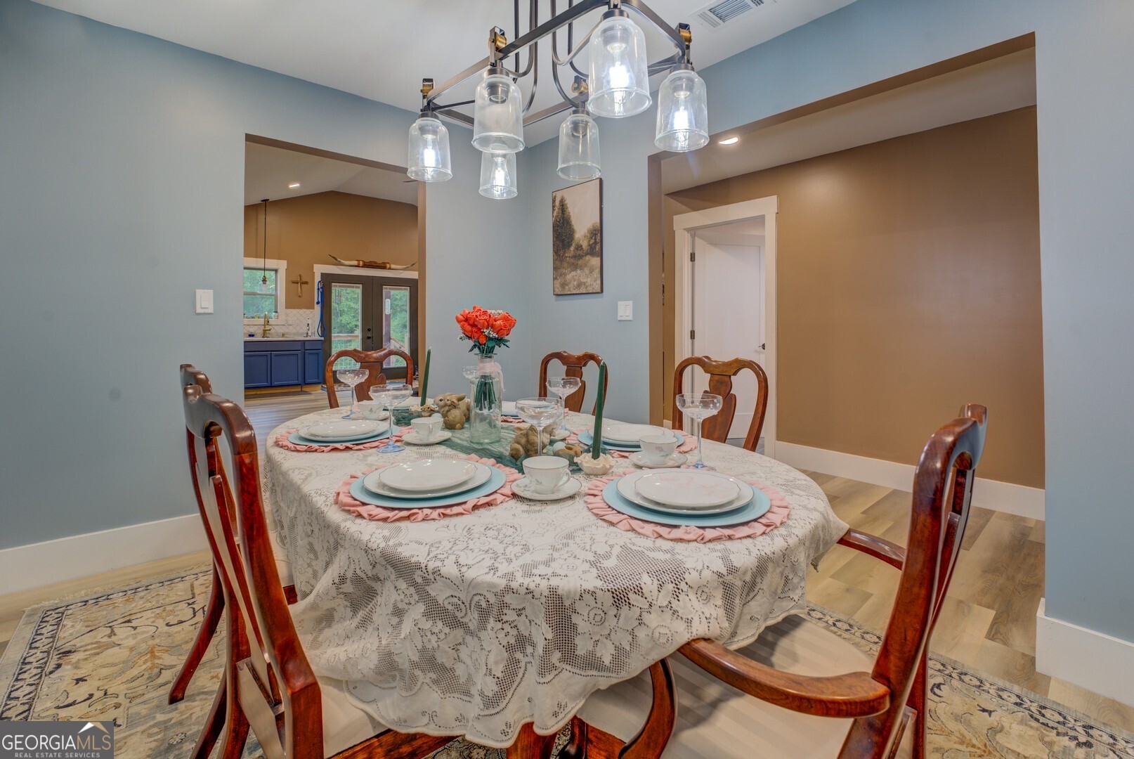 70 McDonald Road Covington, GA 30014 - Photo 64 of 84 a view of a dining room with furniture and a chandelier