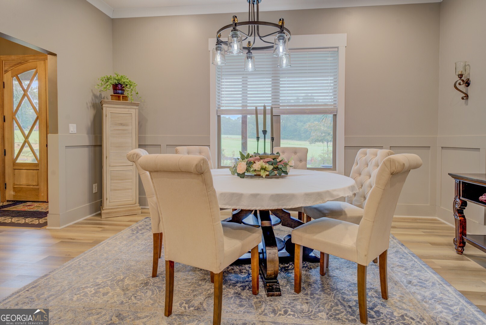 70 McDonald Road Covington, GA 30014 - Photo 7 of 84 a dining room with furniture a chandelier and wooden floor