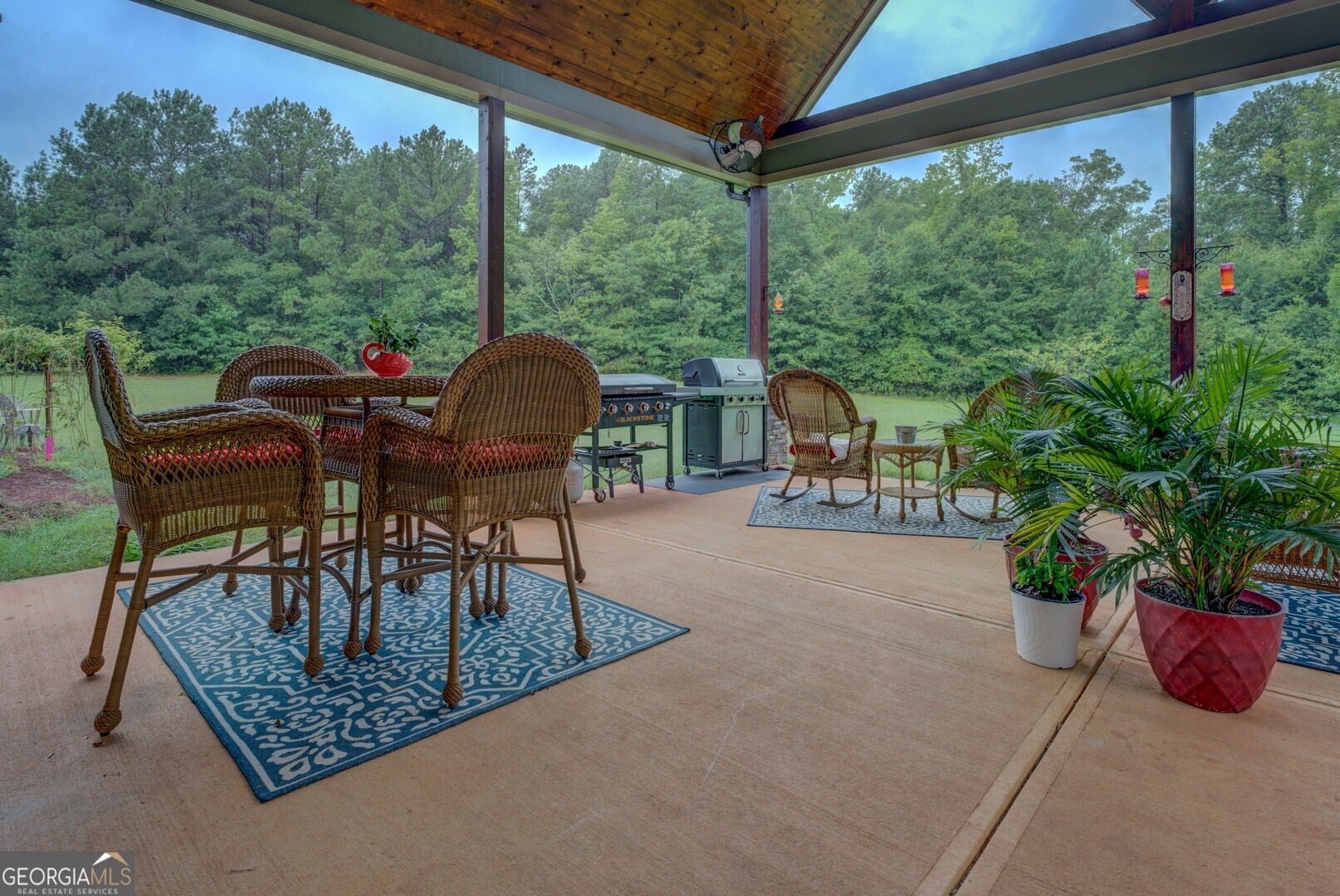 70 McDonald Road Covington, GA 30014 - Photo 71 of 84 a view of a chairs and table in the patio