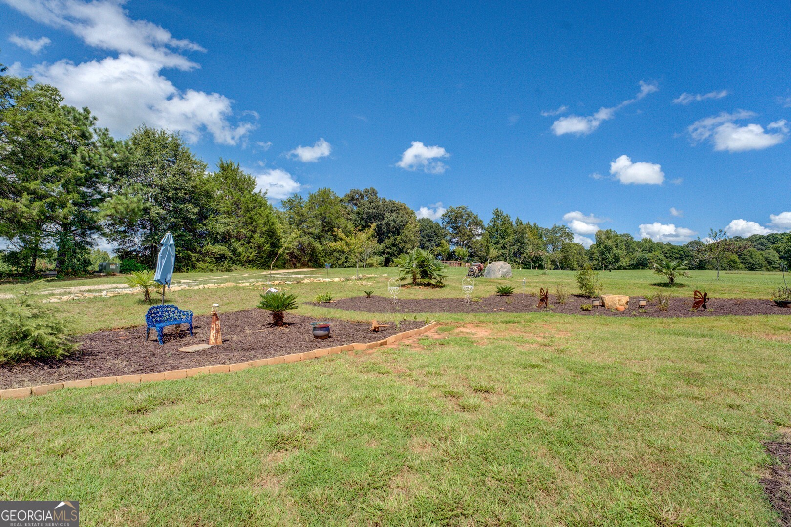 70 McDonald Road Covington, GA 30014 - Photo 80 of 84 a view of a park with swings and slides