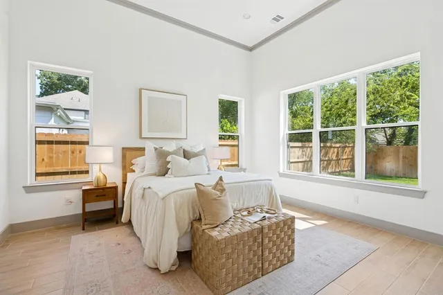 a bed room with couch and a window