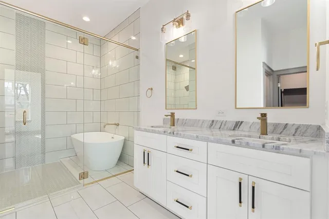 a bathroom with a sink toilet a mirror and shower