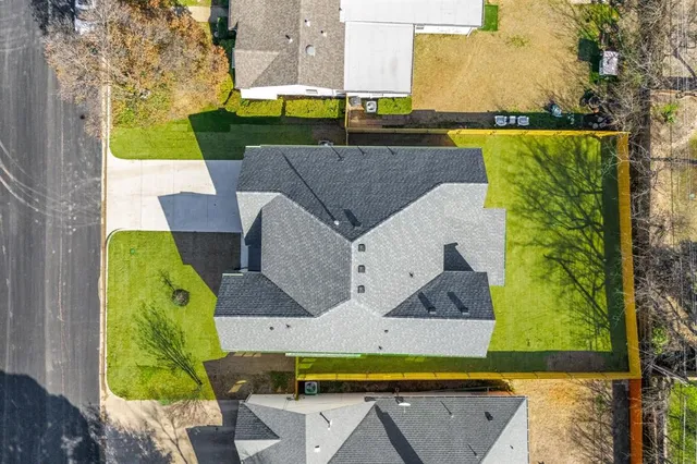 an aerial view of a house with swimming pool