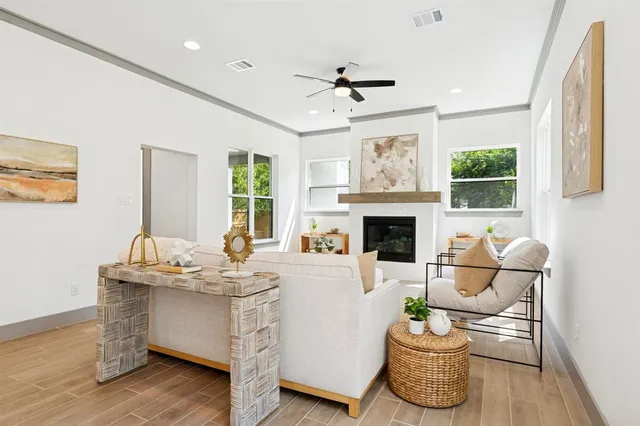 a living room with furniture and a fireplace