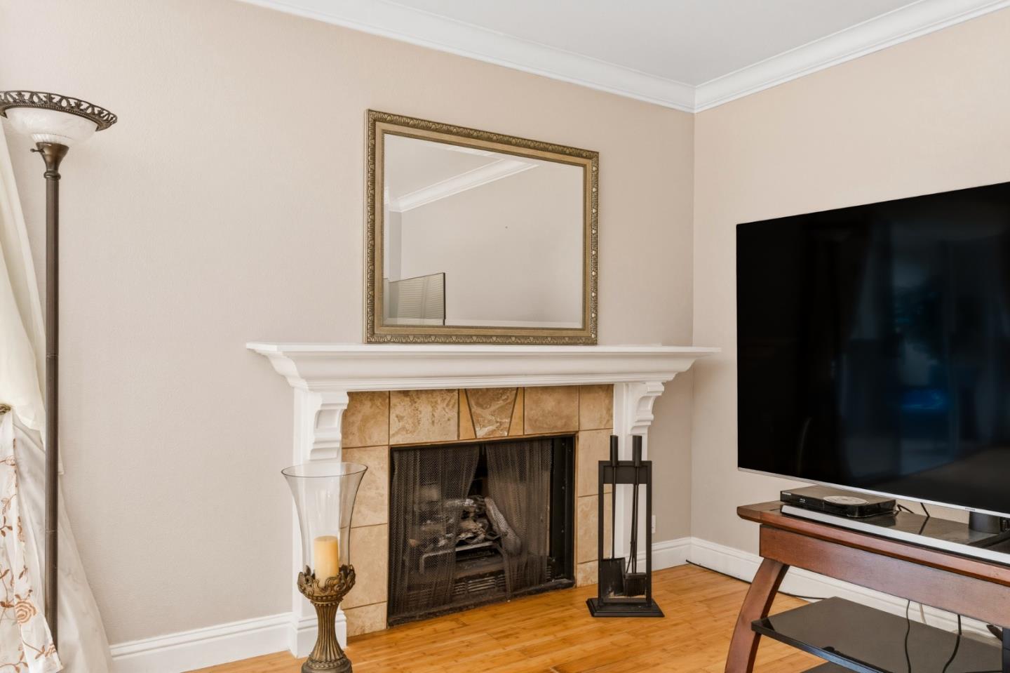 1743 Panda Way Hayward, CA 94541 - Photo 14 of 34 a living room with a fireplace and a flat screen tv
