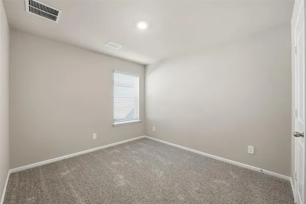 an empty room with a empty space and window