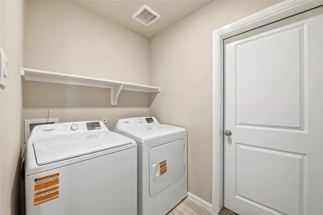 a utility room with dryer and washer