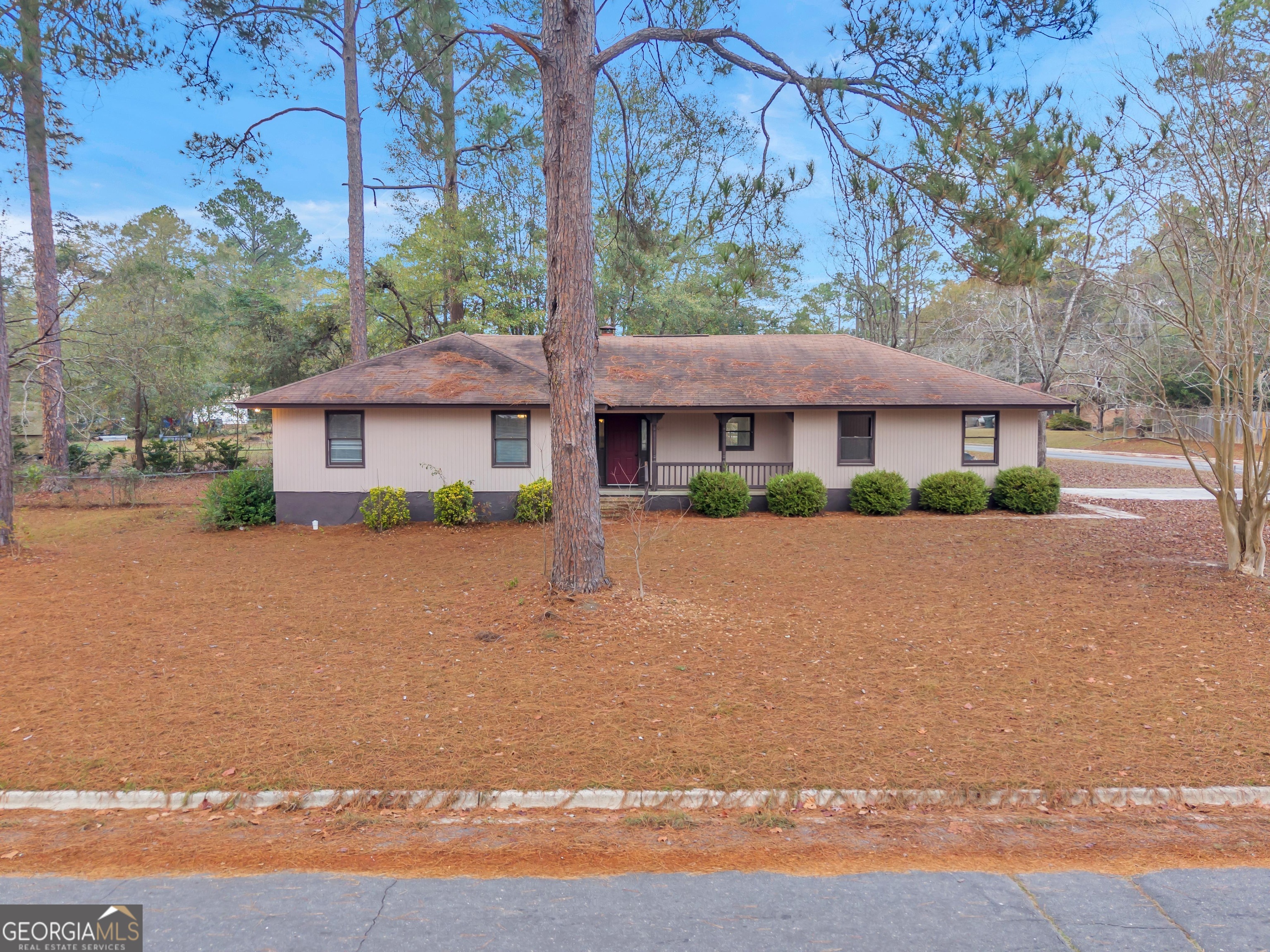 a house with trees in the background