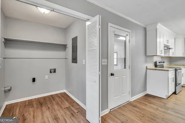 a view of kitchen with a hallway