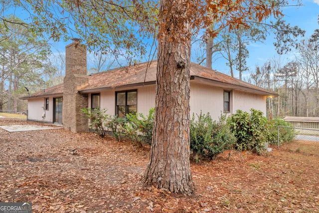 a view of a yard with trees
