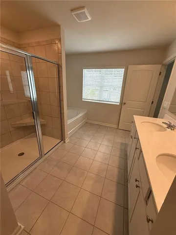 a bathroom with a sink and a shower