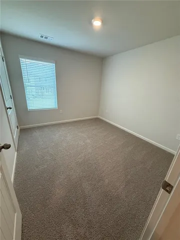 a bathroom with a double vanity sink toilet and mirror