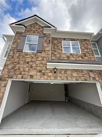 a view of swimming pool with lounge chair and dinning table under an umbrella