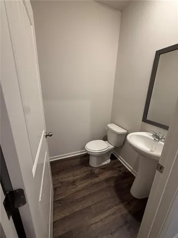 a bathroom with a toilet and a sink