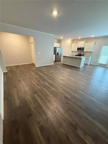 a view of kitchen with furniture and wooden floor