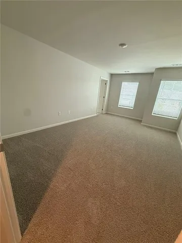 a spacious bathroom with a glass door shower and a sink