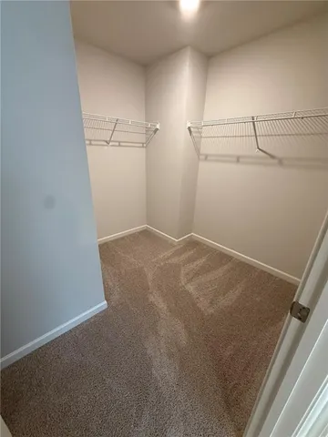 a view of a bathroom with a bathtub and shower