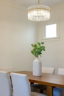a dining room with furniture and wooden floor