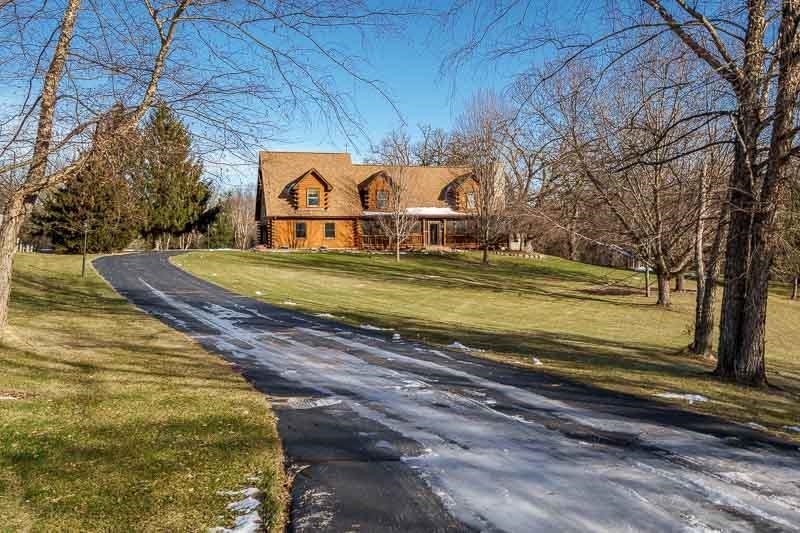 7334 Hawthorne Ridge Roscoe, IL 61073 - Photo 2 of 79 a view of a yard with large trees