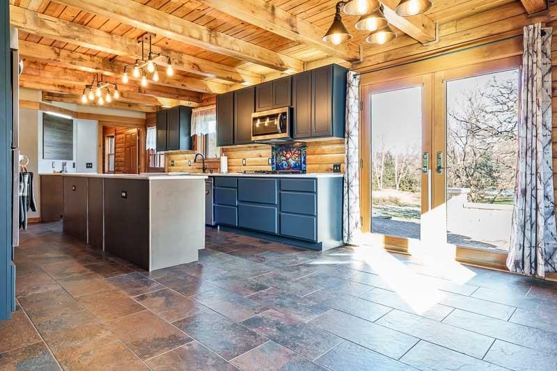 7334 Hawthorne Ridge Roscoe, IL 61073 - Photo 7 of 79 a large kitchen with kitchen island granite countertop a large window and stainless steel appliances