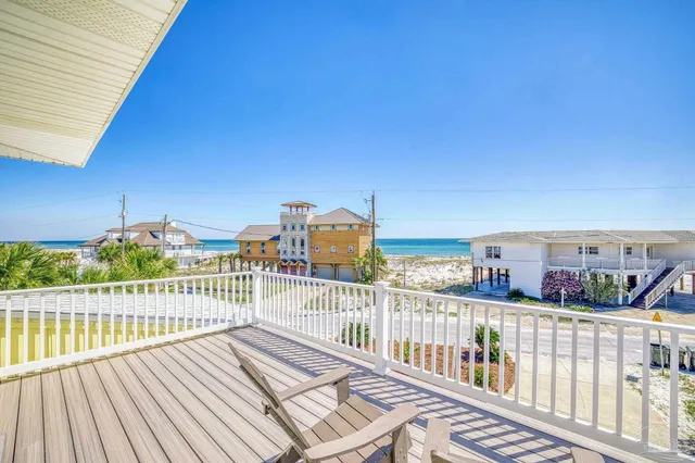 a view of balcony with wooden floor