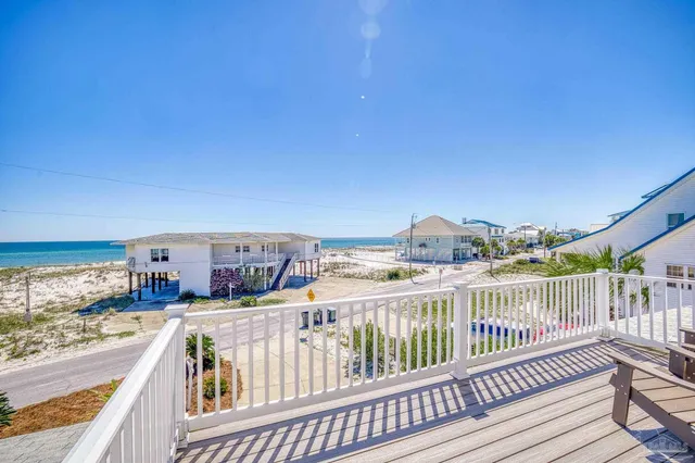 a view of a balcony with wooden floor