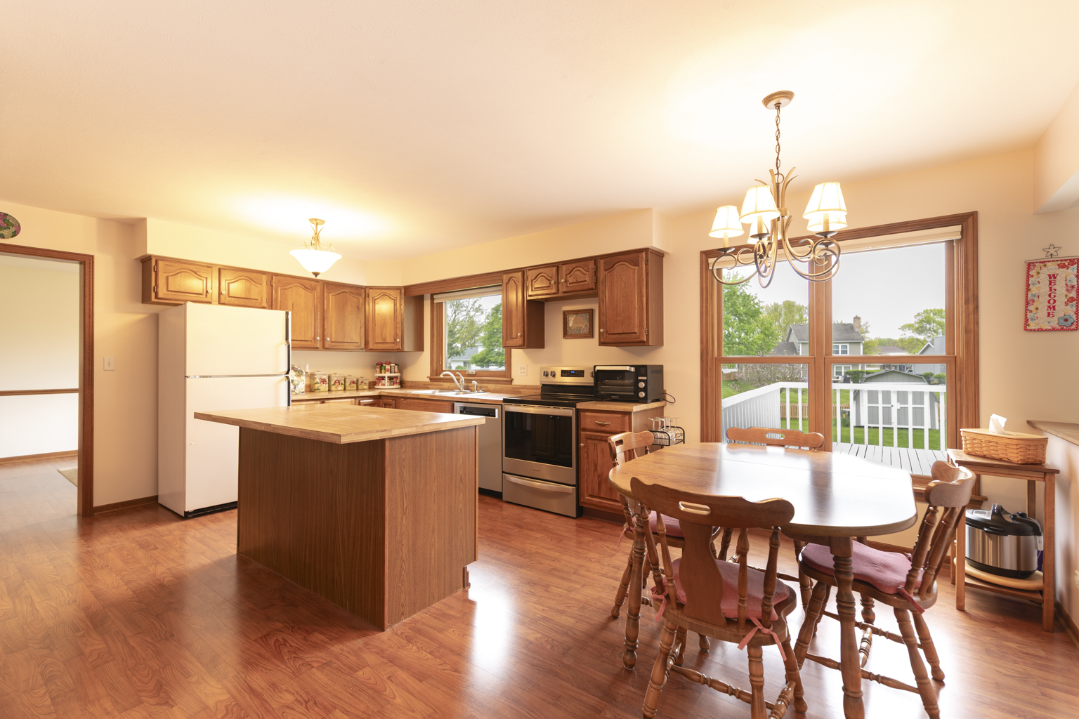 1494 Applegate Drive Naperville, IL 60565 - Photo 11 of 35 a kitchen with stainless steel appliances granite countertop a stove and a dining table with granite countertop