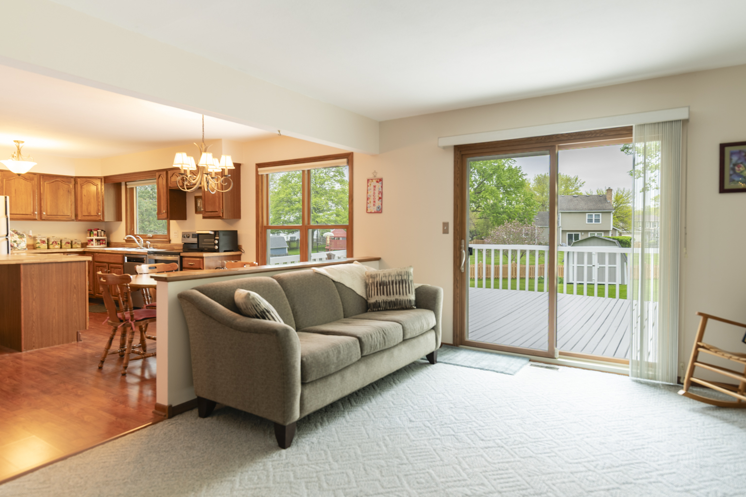 1494 Applegate Drive Naperville, IL 60565 - Photo 15 of 35 a living room with furniture and a floor to ceiling window