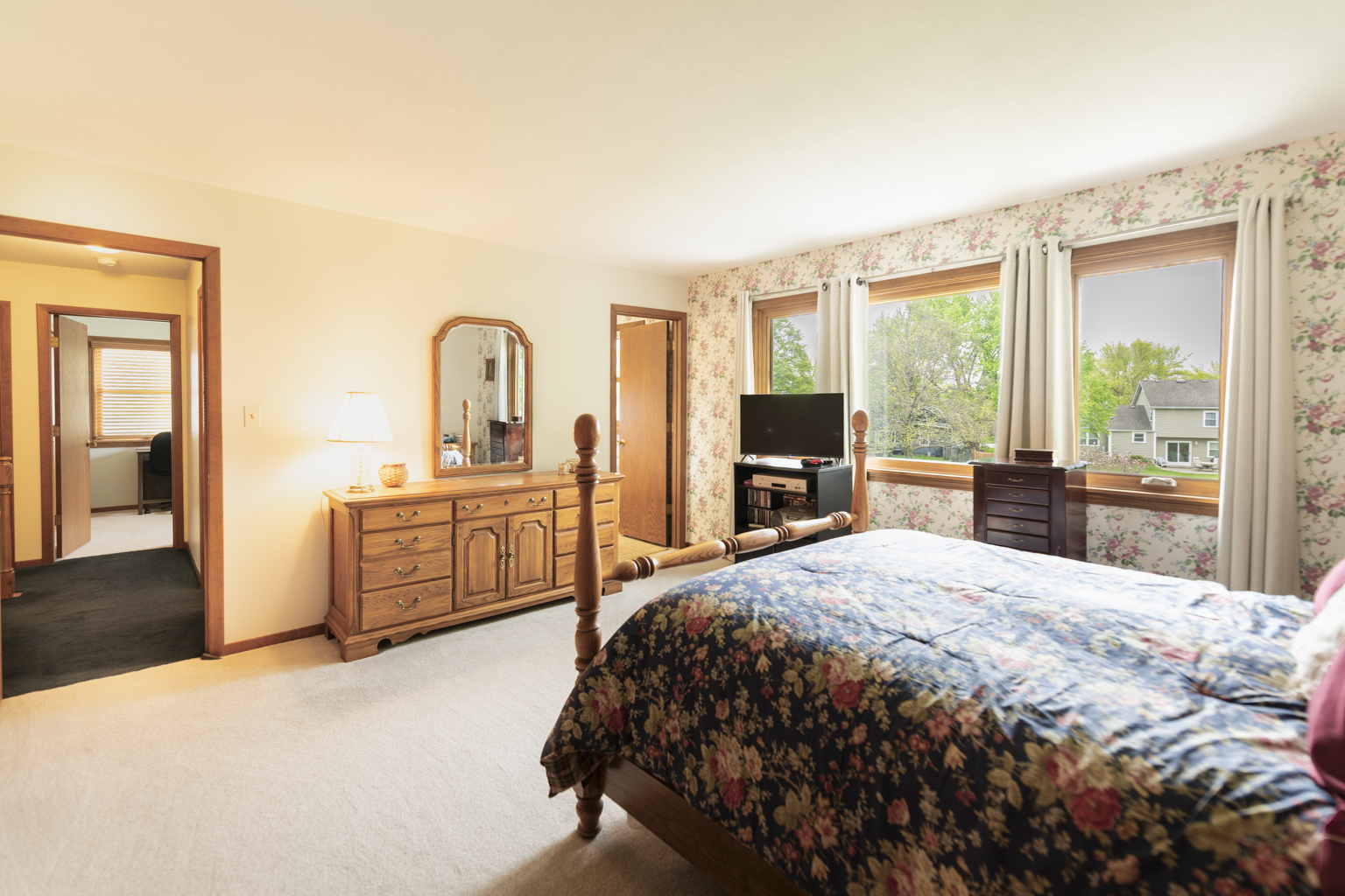 1494 Applegate Drive Naperville, IL 60565 - Photo 16 of 35 a bedroom with a bed next to a large window with outer view