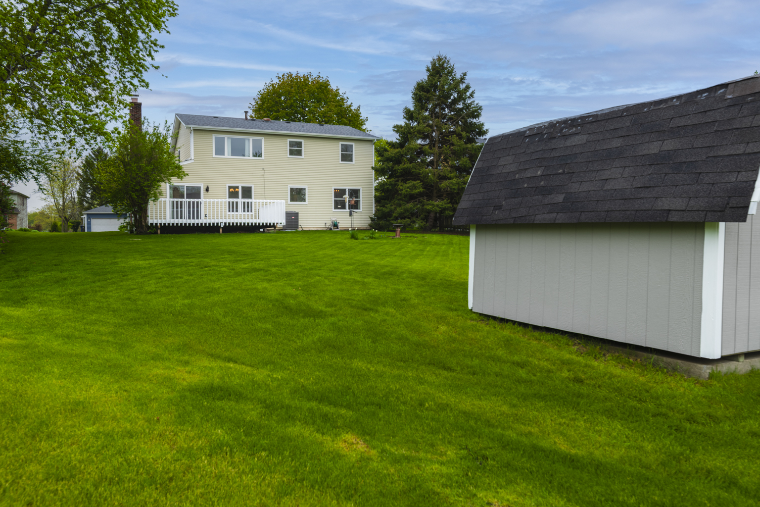 1494 Applegate Drive Naperville, IL 60565 - Photo 25 of 35 a view of a backyard with plants and a garden