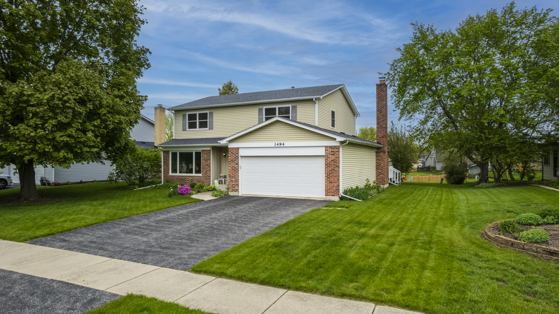 1494 Applegate Drive Naperville, IL 60565 - Photo 3 of 35 a front view of a house with a yard and trees